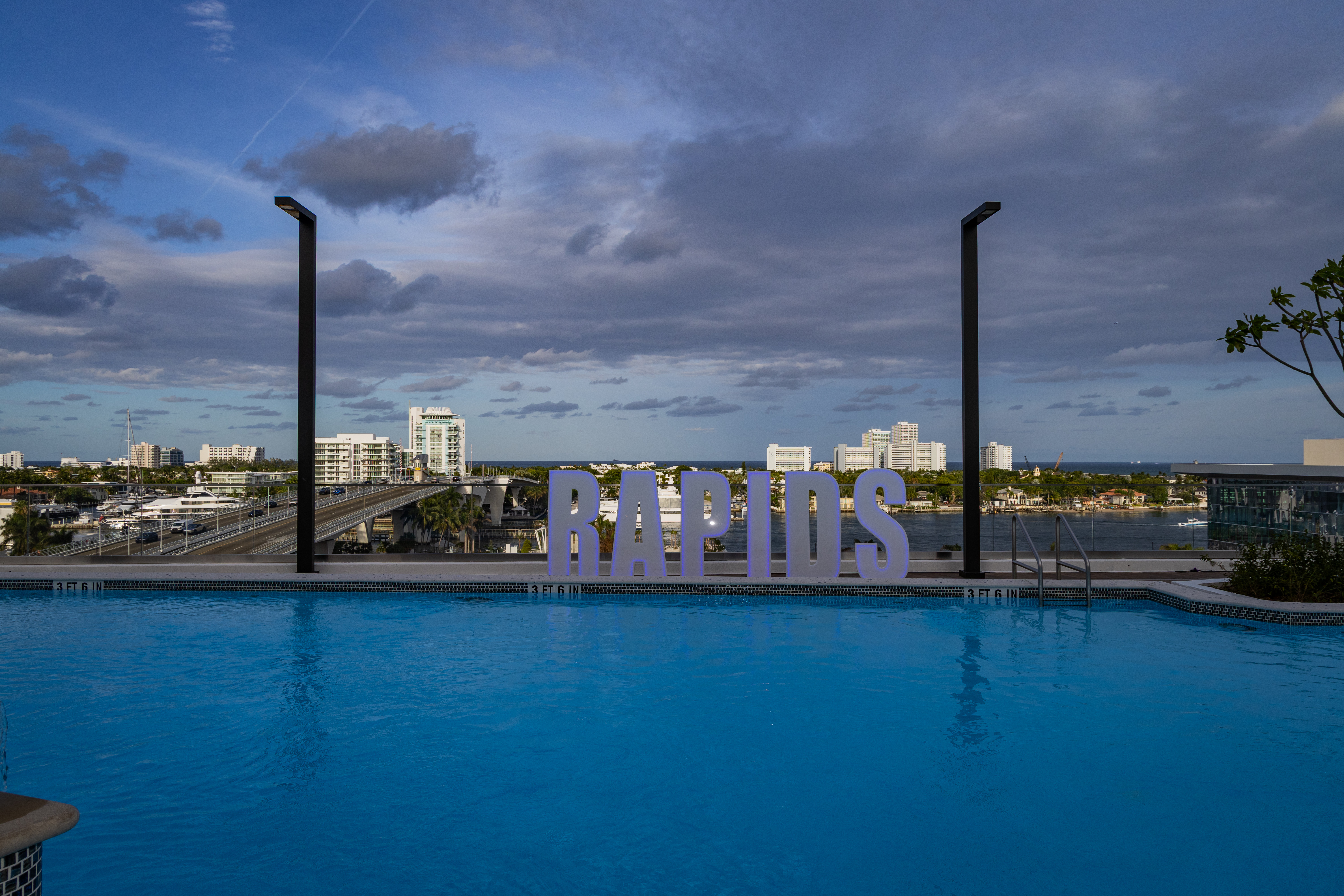 view from pool deck of omni ft lauderdale with skyline and the words RAPIDS 