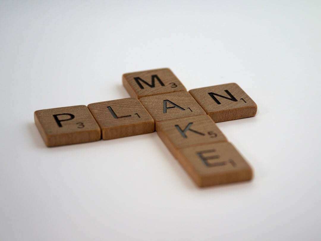 scrabble game tiles to make two words make and plan