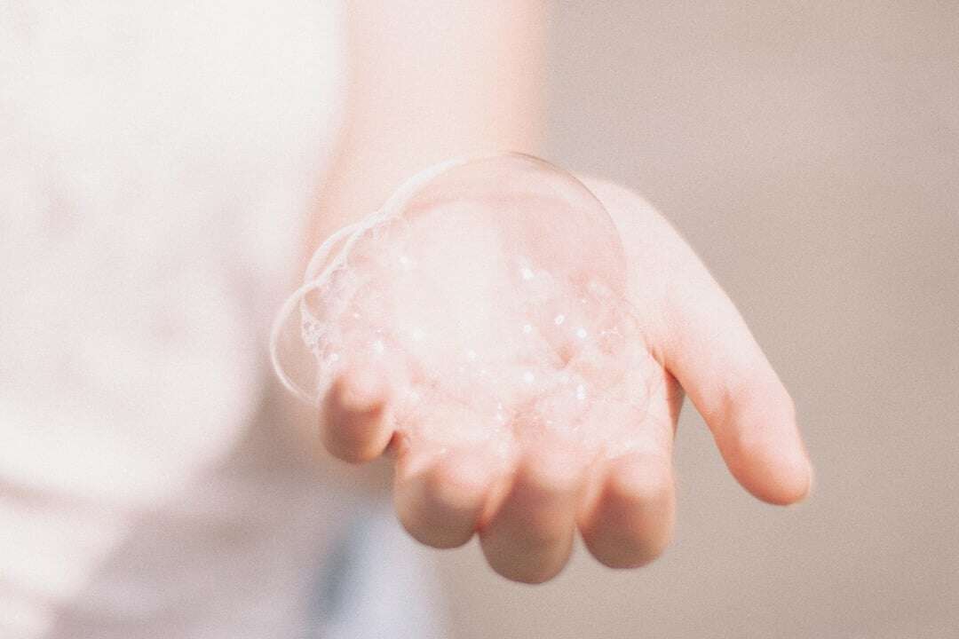 hand with soap bubbles