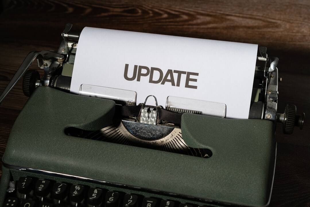 old style typewriter with a paper loaded in it with the word update all in capital letters