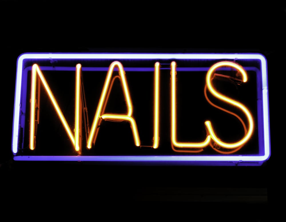 Neon sign in window of beauty shop