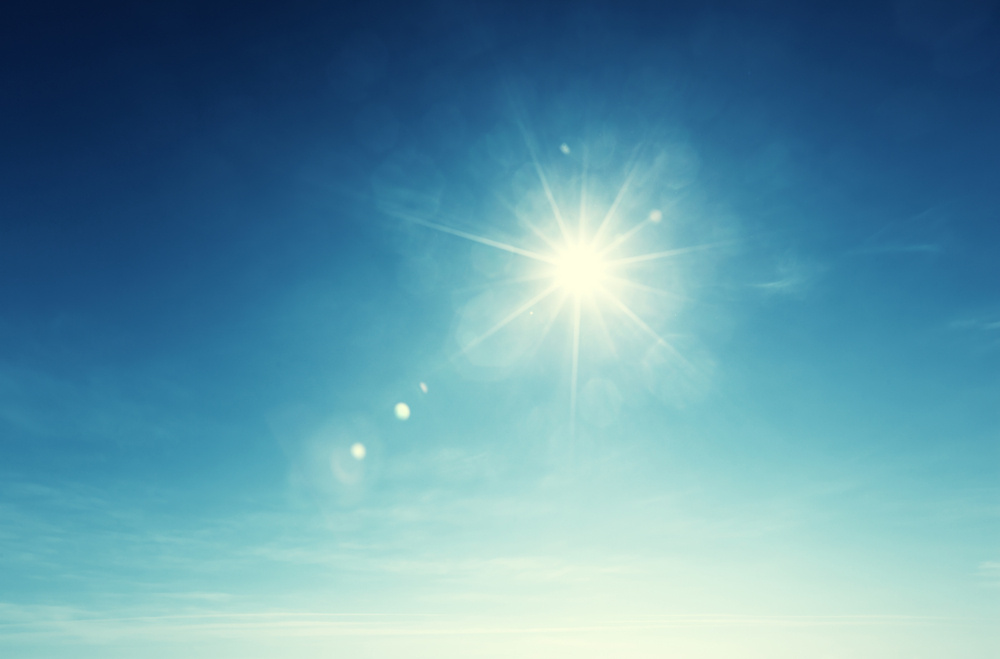 sun shining in a blue sky